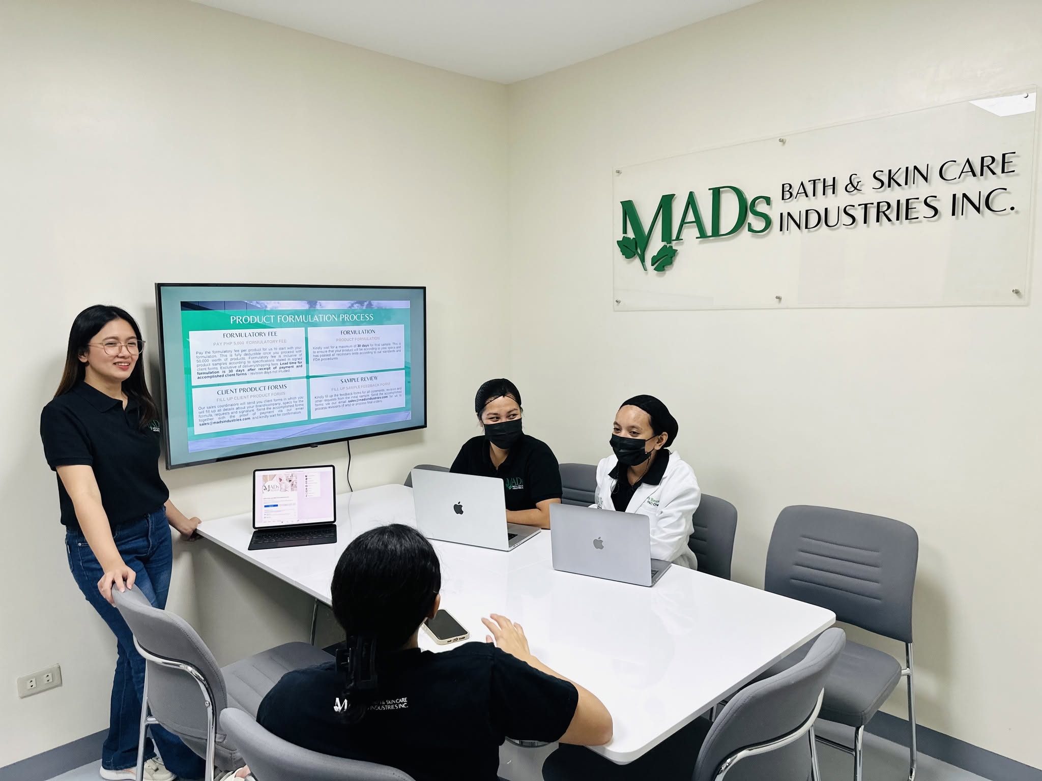 MADS team discussing the product formulation process in the meeting room